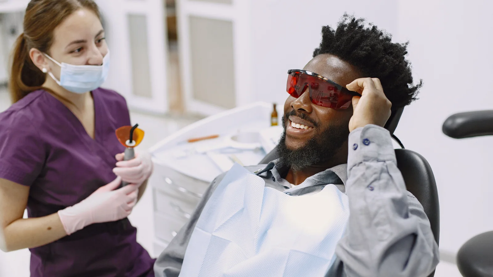 Relaxed adult smiling during a comfortable dental visit.