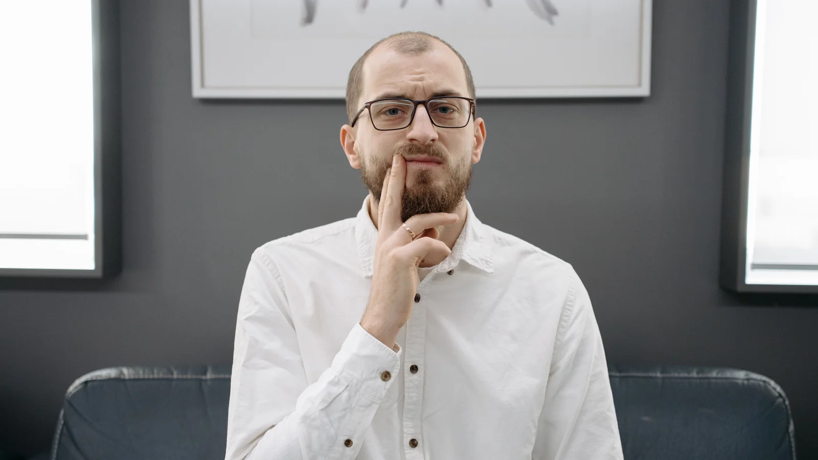 Man experiencing discomfort from a toothache.